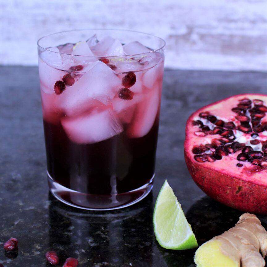 Ppmegranate juice, gin, seltzer, ginger, lime, and arils (pomegranate seeds) gives this cocktail it's beautiful color.