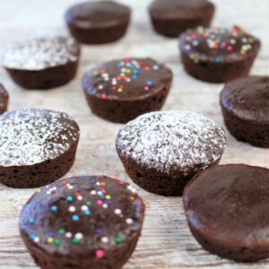 Healthier Brownie Bites topped with powdered sugar and sprinkles