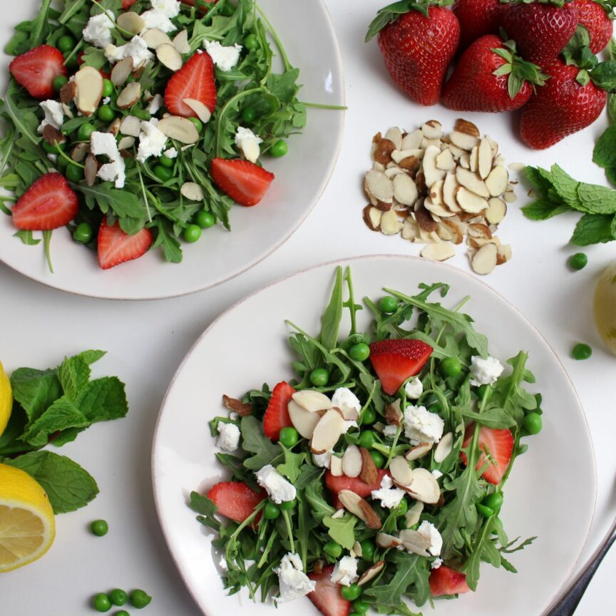 2 plates of springy arugula salad with lemon mint dressing