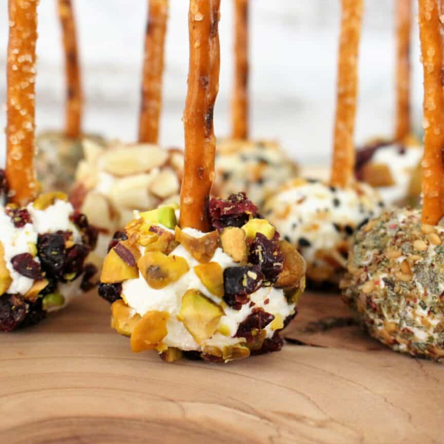 goat cheese balls with pistachios and cranberries, everything bagel seasoning, and za'atar