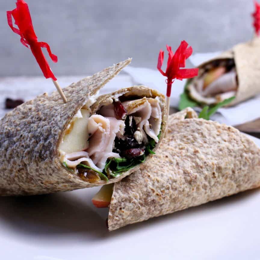 Whole grain wrap with turkey, dried cranberries, fig jam, and arugula rolled up into a delicious Fall flavored wrap.