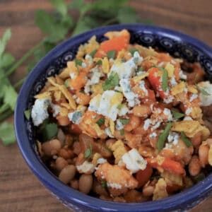 Bowl full of Buffalo Vegetarian Chili with blue cheese crumbles on top.