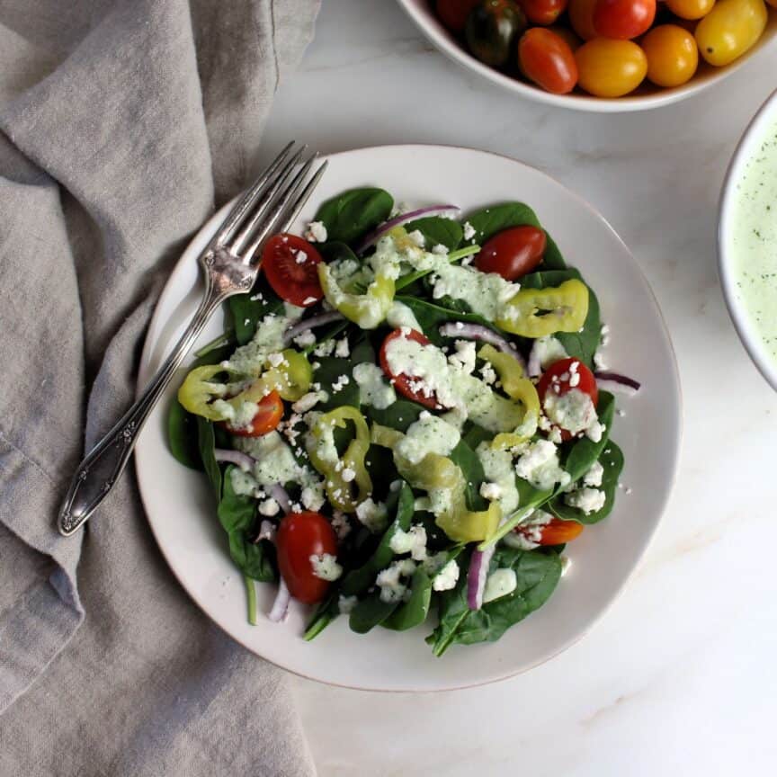 Tzatziki salad dressing on Greek salad.