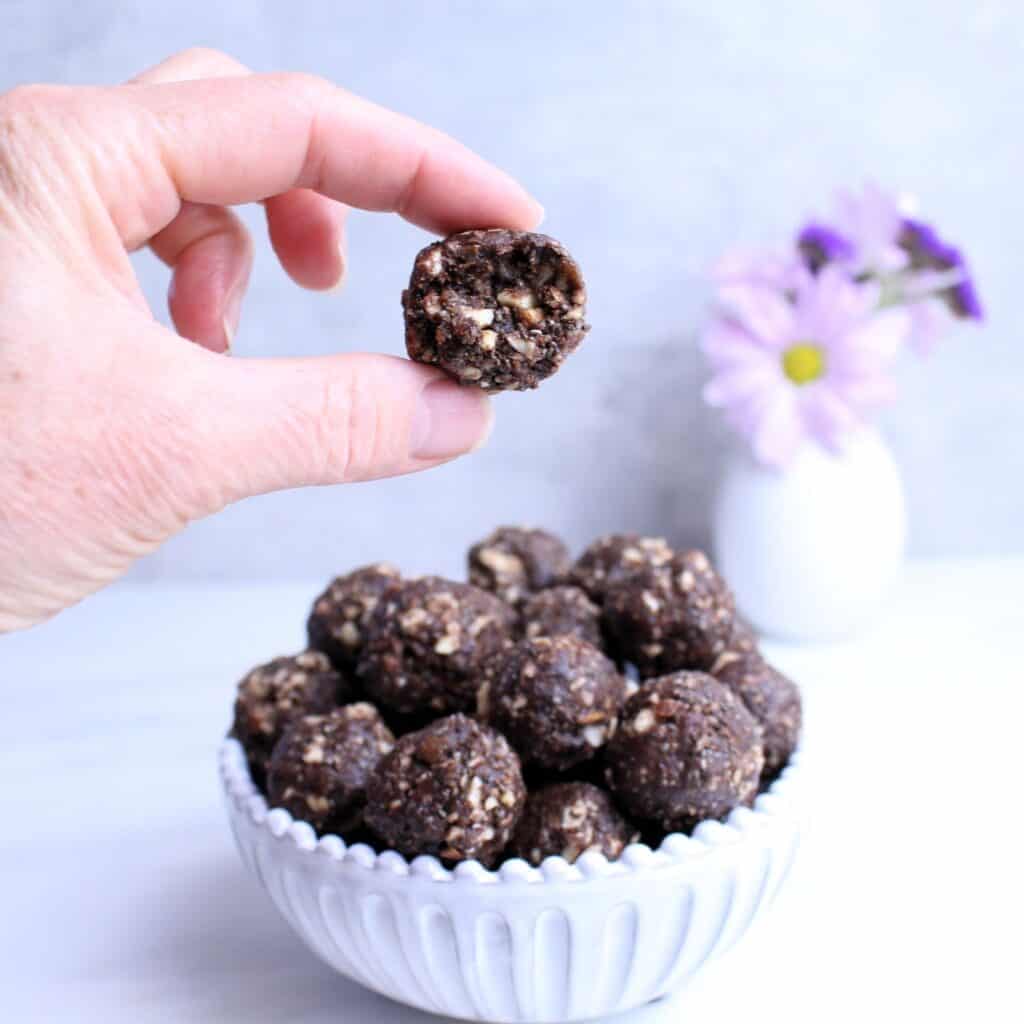 Peanut butter date ball with bite.