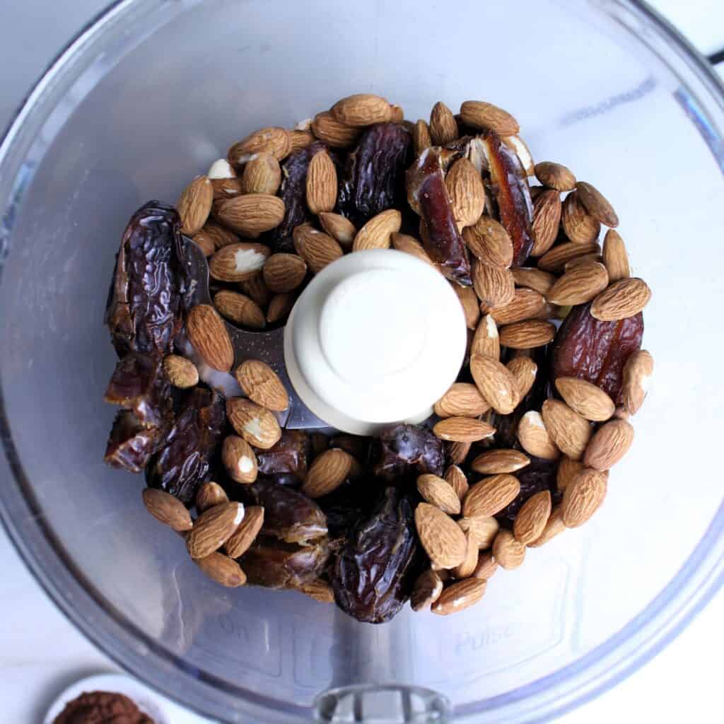 Medjool dates and almonds in a food processor.