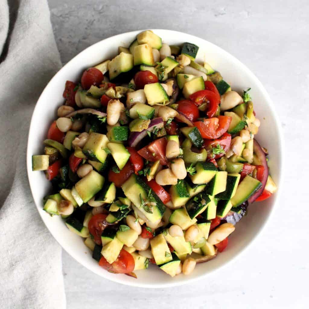 Overview of Tuscan salad in white bowl.